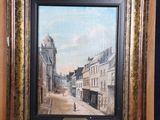 an oil painting of a street scene in a wooden easel