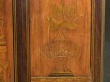 two wooden doors with carvings on them on the floor