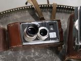 two cameras that are sitting on a table