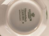 a close up of a cup and saucer on a table