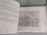 an open book with a picture of a castle on it