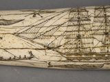 a whale tooth with a drawing of a ship on it