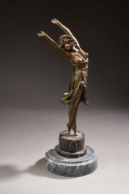 an image of a bronze statue of a woman holding a tennis racquet