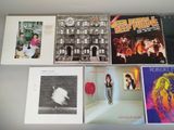 a lot of records that are on the table