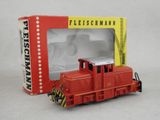 a toy train that is in a box on the table