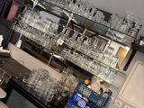 a bar with a lot of wine glasses on it