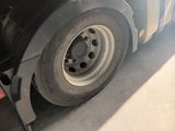 a close up of a flat tire on a semi truck