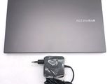 a laptop that has a charger attached to it