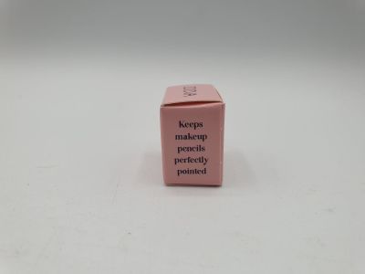 a close up of a pink box on a white surface