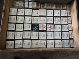 a box full of boxes of cigarettes sitting on the ground