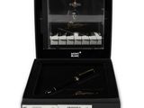 a close up of a pen in a box with a piano in the background