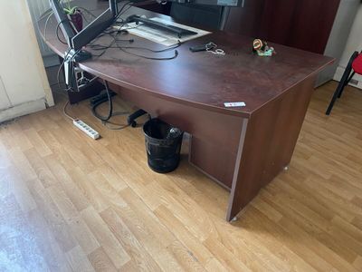a desk with a laptop and a monitor on it