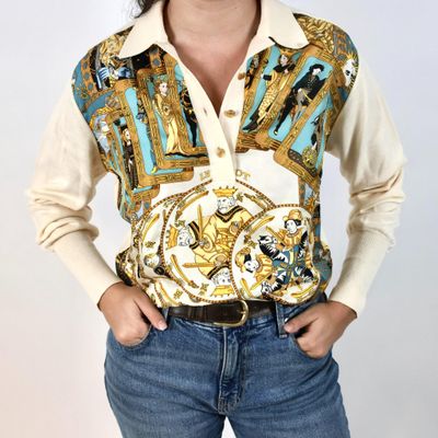 a woman posing for a picture wearing a shirt and jeans