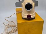 a yellow box with a camera attached to it