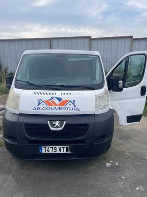 a white van that is parked in a parking lot