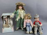 three dolls that are sitting next to each other