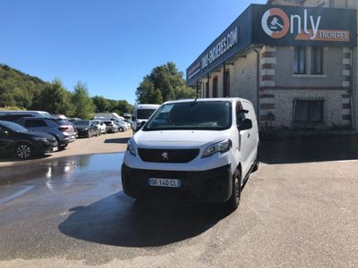a white van parked in front of a building