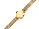 a close up of a gold watch on a white background
