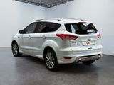 the rear end of a white ford kuga parked in a garage