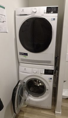 an image of a washer and dryer in a small room
