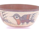 a bowl that has a bird design on it
