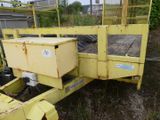a yellow trailer with a box on the back of it