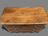 an old wooden chest of drawers with brass handles and drawers
