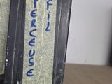 two black boxes with blue writing on them sitting on a table