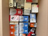 a cardboard box filled with many different types of electronic equipment