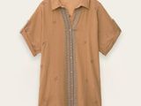 an image of a brown shirt with a design on the front