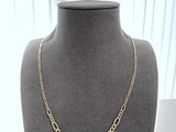 a gold chain necklace on a mannequin mannequin display