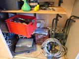 a shelf with a bunch of tools on it in a room