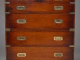 an antique wooden chest of drawers with brass handles