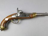 an old gun that is on display on a table