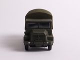 a toy army truck that is sitting on a white surface