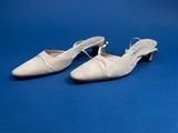 a pair of white shoes on a blue background