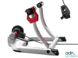 the bike trainer is connected to a cable with a red handle