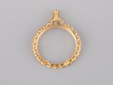 a close up of a gold ring on a white background