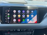 an image of a car dashboard with a display of various apps