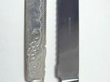 two knives that are sitting next to each other on a table
