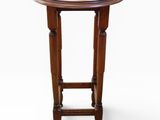 an image of a small wooden table with a round top