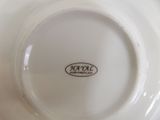 a white plate with a black and white logo on it