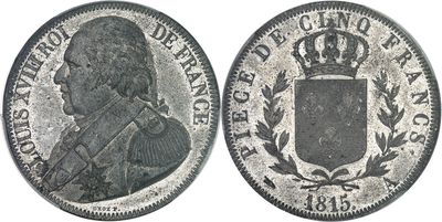 a close up of a coin with a crown on top of it
