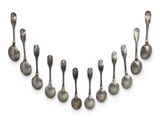 an assortment of silver spoons and spoon spoons on a white surface