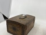 a small wooden box sitting on a white surface
