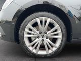 a close up view of a car ' s tire on the street