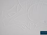 a close up of a piece of paper with a drawing of a fish on it