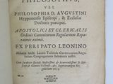 an old book with writing on it sitting on top of a table