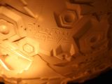a close up of a candle that is lit in the dark