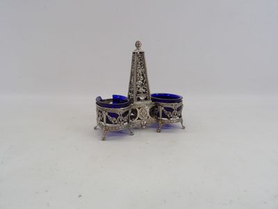 an image of a silver and blue glass candle holder on a white surface